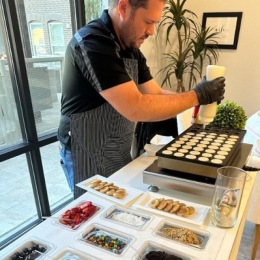 a person cooking pancakes