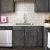 a kitchen with black cabinets