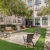 a courtyard with benches and trees