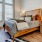 a bedroom with a bed and a lamp