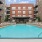 a swimming pool in a courtyard between buildings