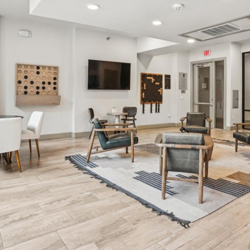 Enjoy our resident-only features a room with tables and chairs